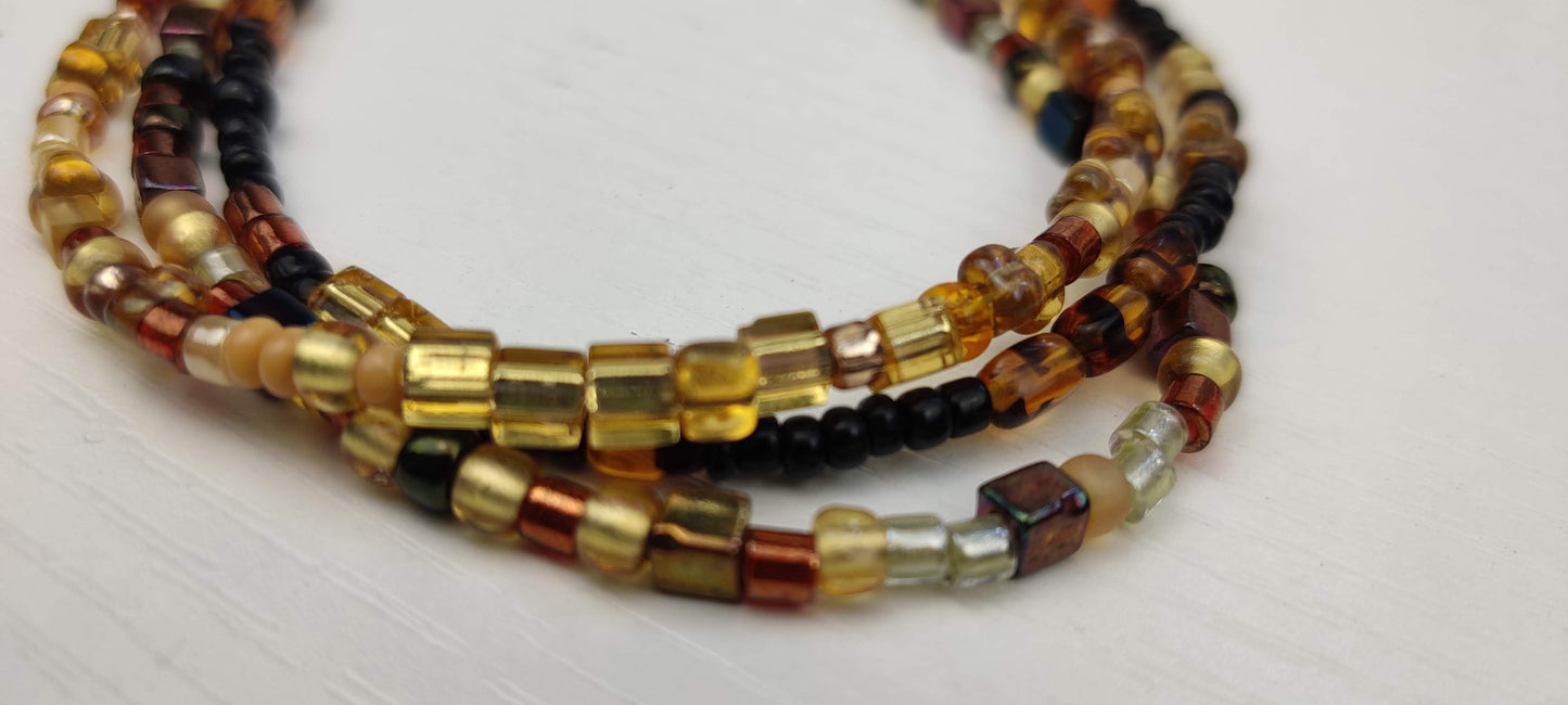 Three Strand Minimalist Bracelet with Gold, Brown, and Black Glass Beads