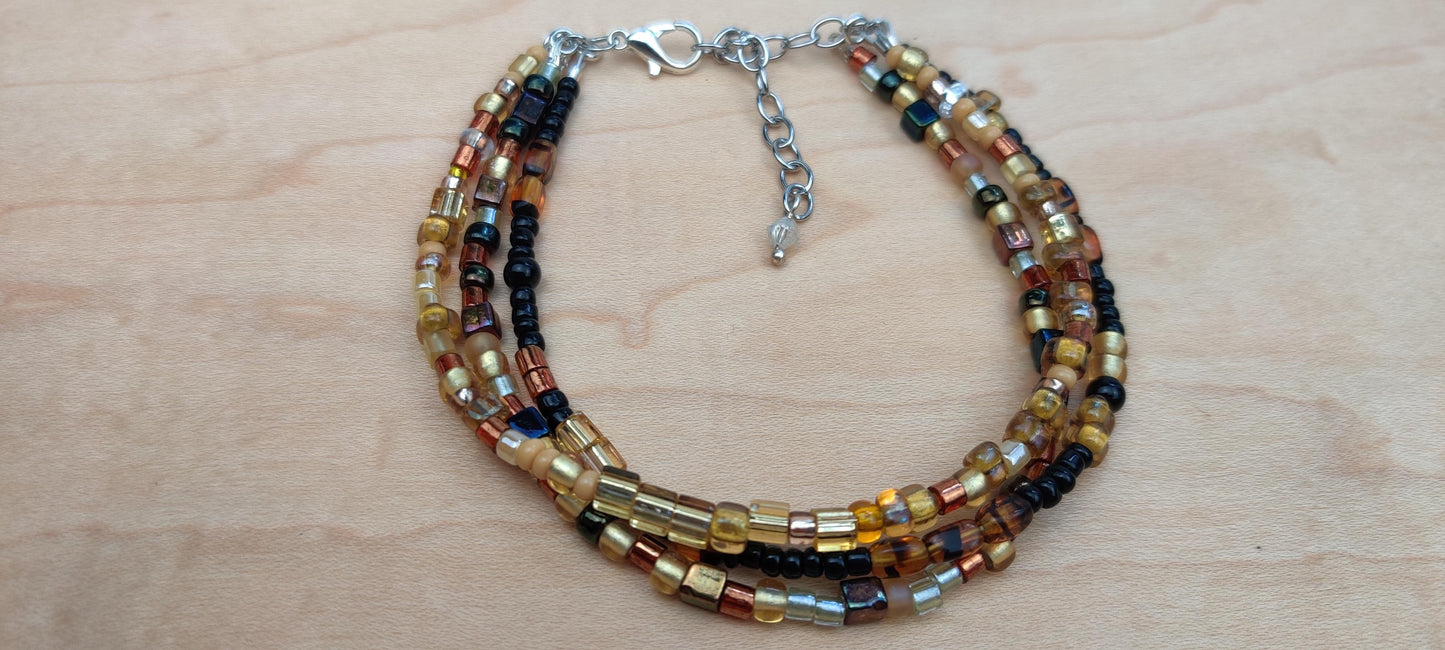Three Strand Minimalist Bracelet with Gold, Brown, and Black Glass Beads