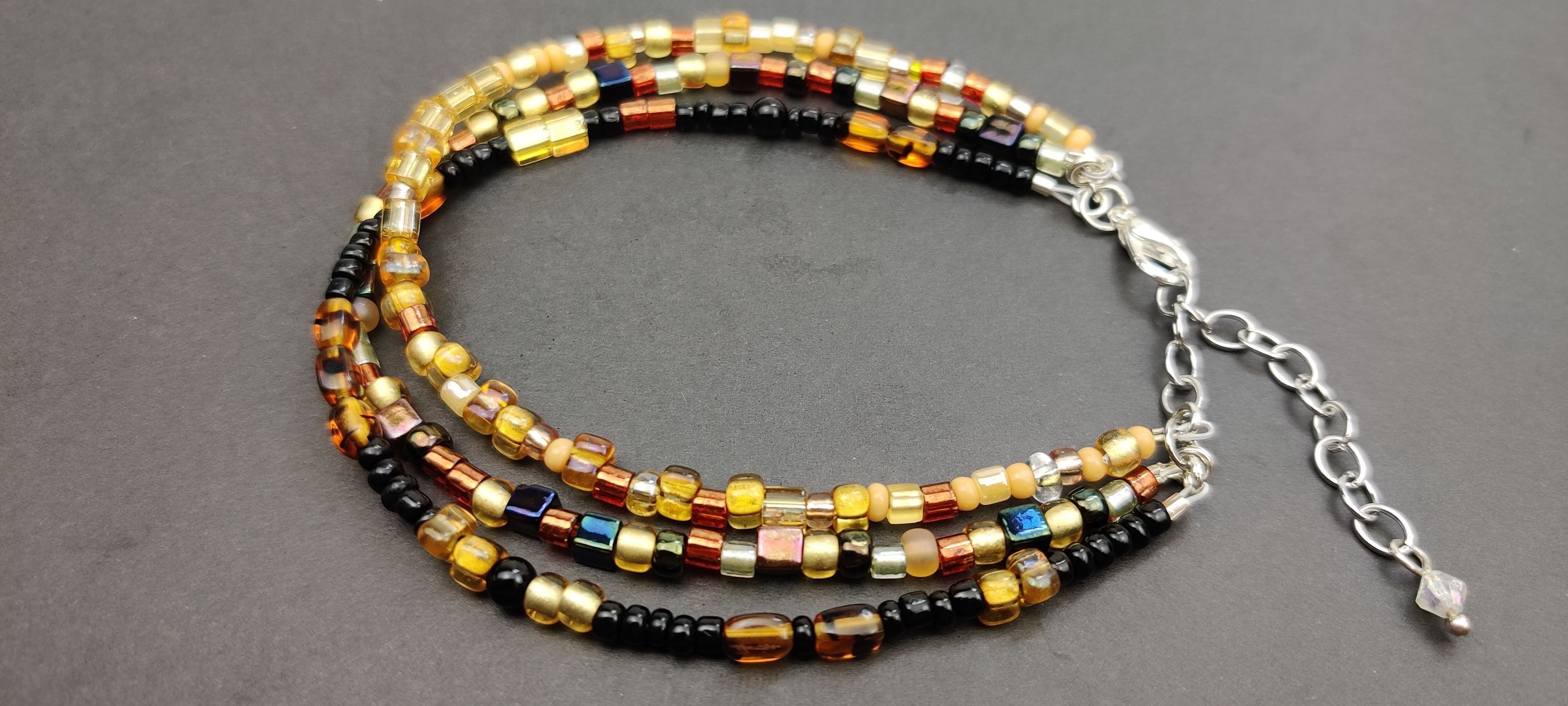 Three Strand Minimalist Bracelet with Gold, Brown, and Black Glass Beads