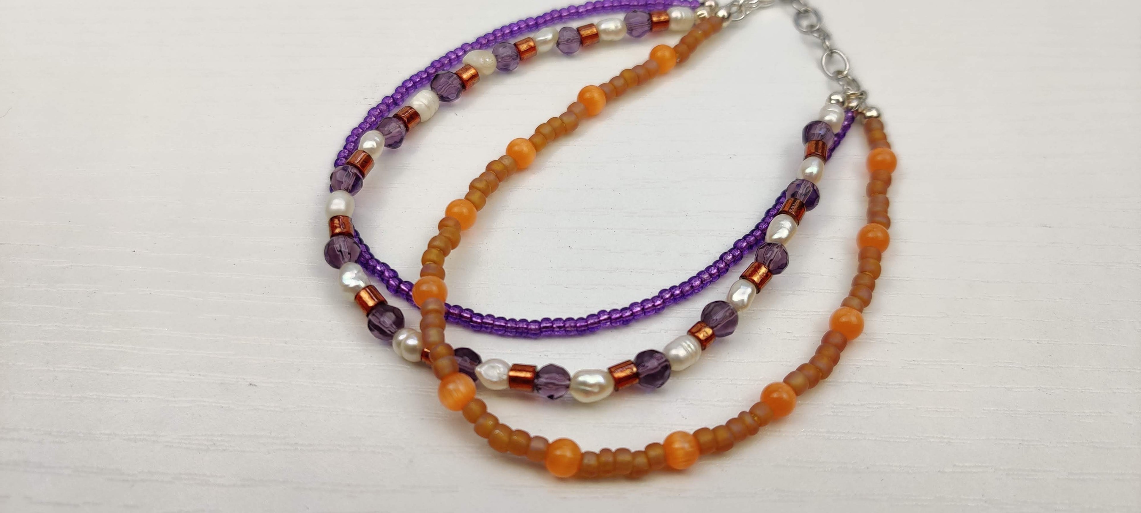 Three Strand Orange, Purple, and Freshwater Pearls Bracelet with Gold, Brown, and Black Glass Beads