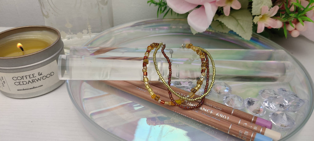 Three Strand Bracelet with Gold, Brown, and Beige Glass Beads