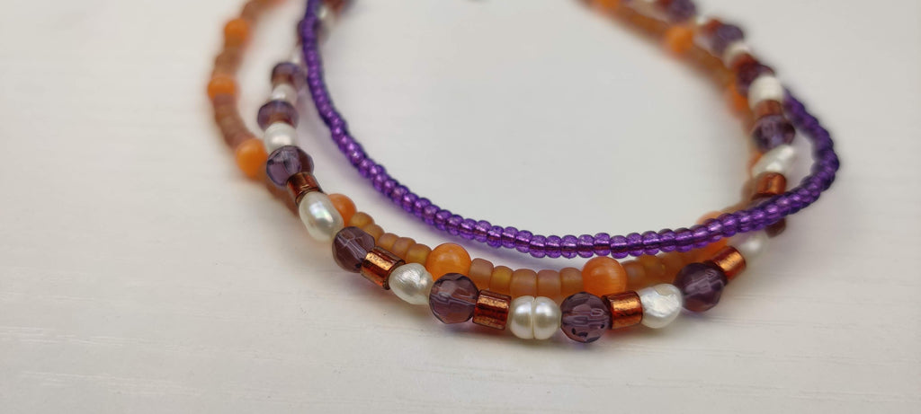 Three Strand Orange, Purple, and Freshwater Pearls Bracelet with Gold, Brown, and Black Glass Beads