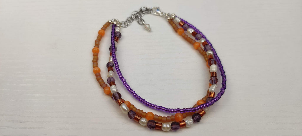 Three Strand Orange, Purple, and Freshwater Pearls Bracelet with Gold, Brown, and Black Glass Beads