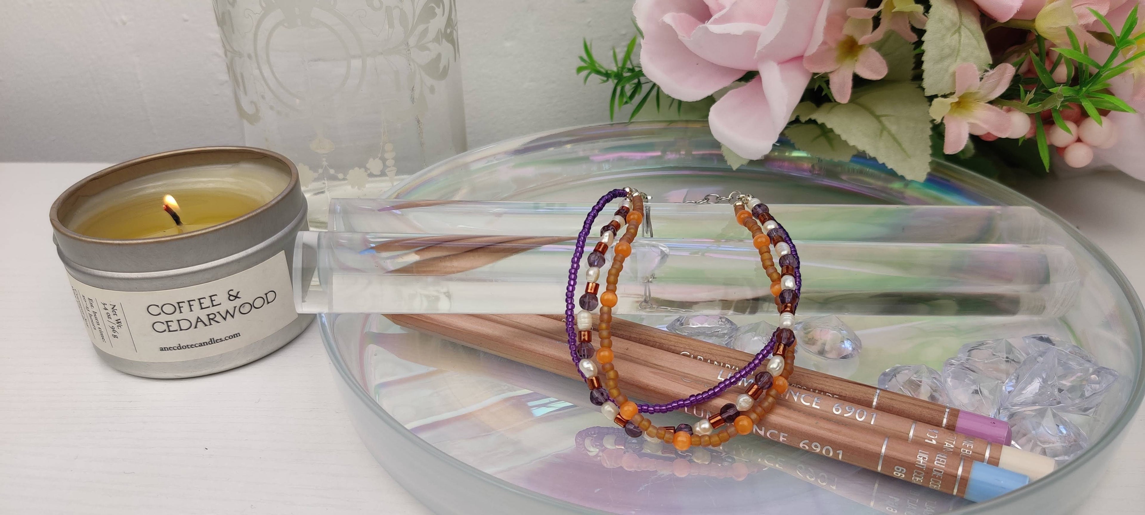 Three Strand Orange, Purple, and Freshwater Pearls Bracelet with Gold, Brown, and Black Glass Beads