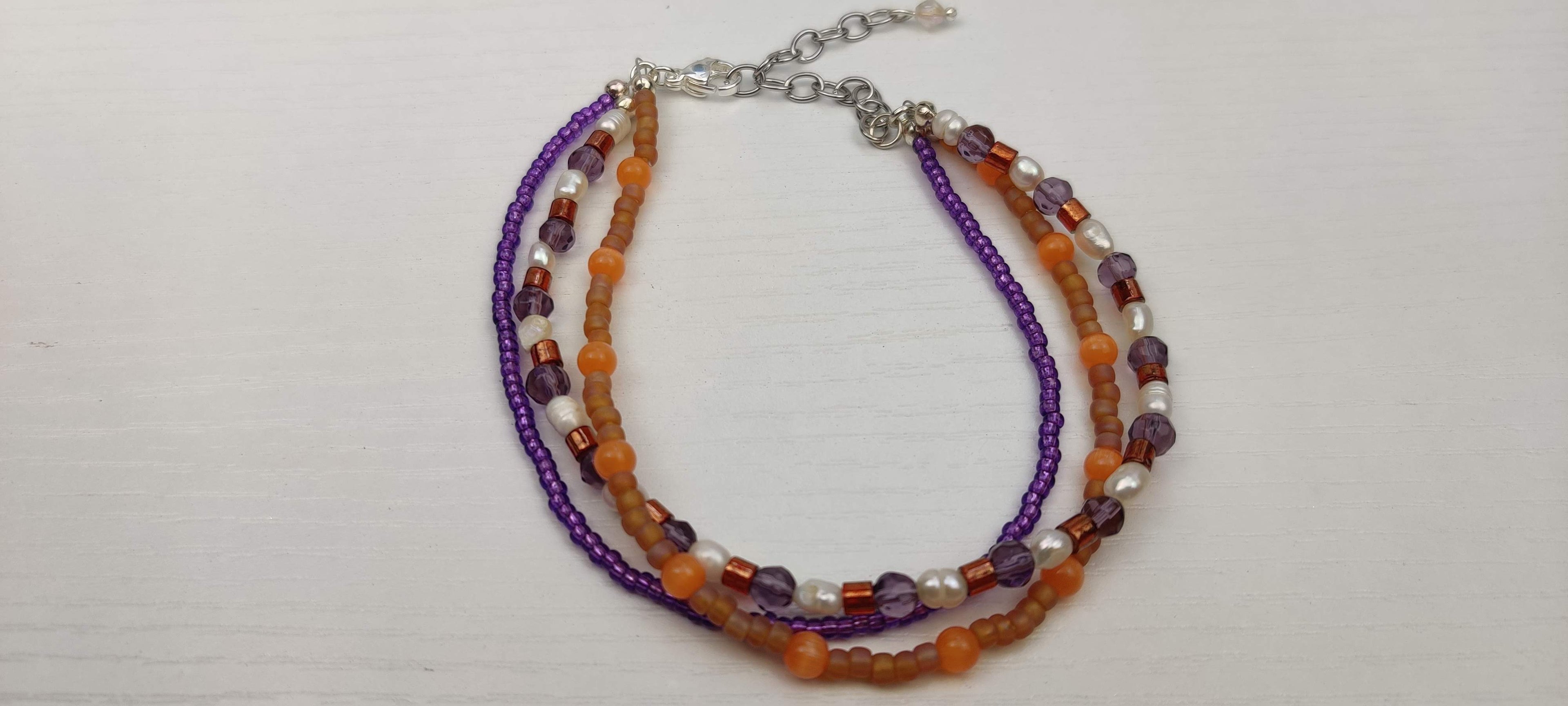 Three Strand Orange, Purple, and Freshwater Pearls Bracelet with Gold, Brown, and Black Glass Beads
