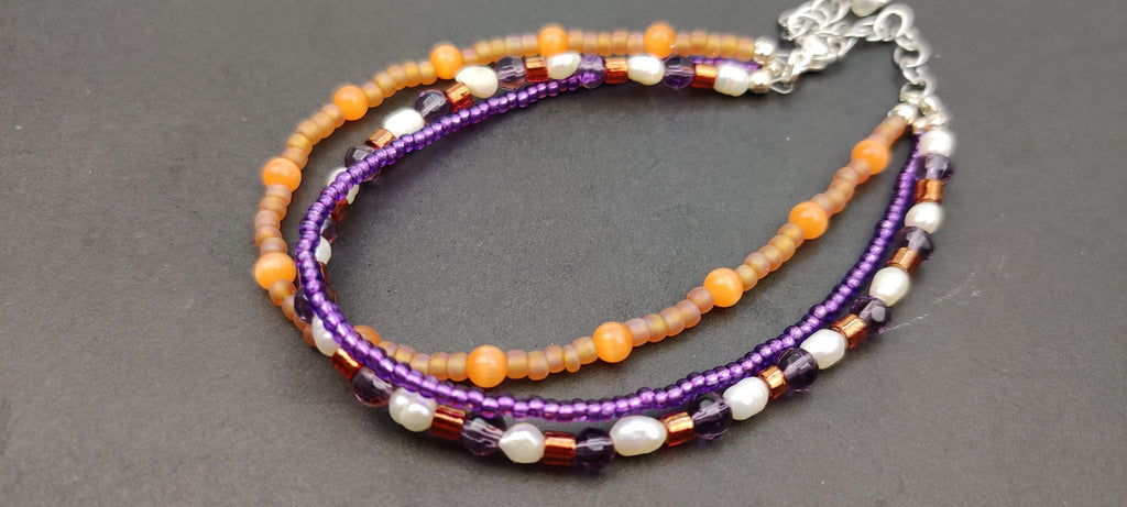 Three Strand Orange, Purple, and Freshwater Pearls Bracelet with Gold, Brown, and Black Glass Beads