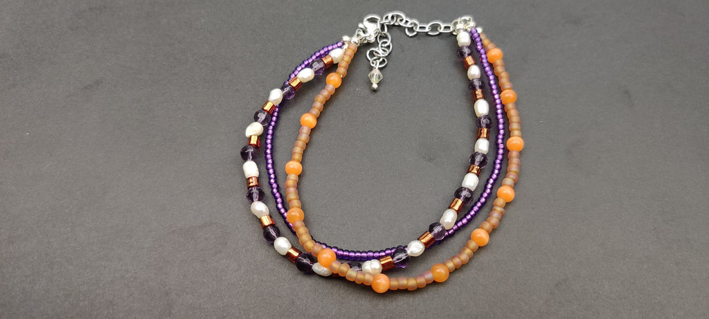 Three Strand Orange, Purple, and Freshwater Pearls Bracelet with Gold, Brown, and Black Glass Beads