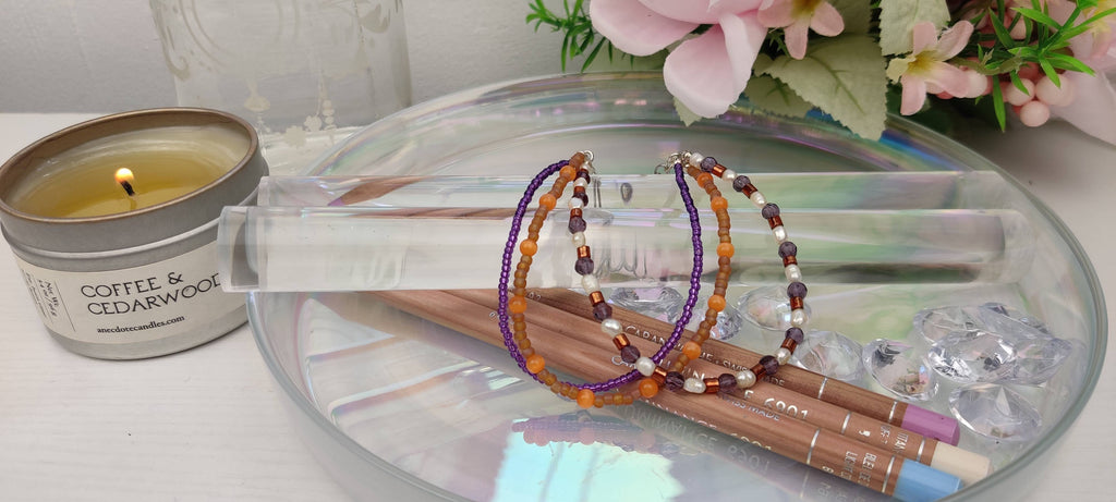 Three Strand Orange, Purple, and Freshwater Pearls Bracelet with Gold, Brown, and Black Glass Beads