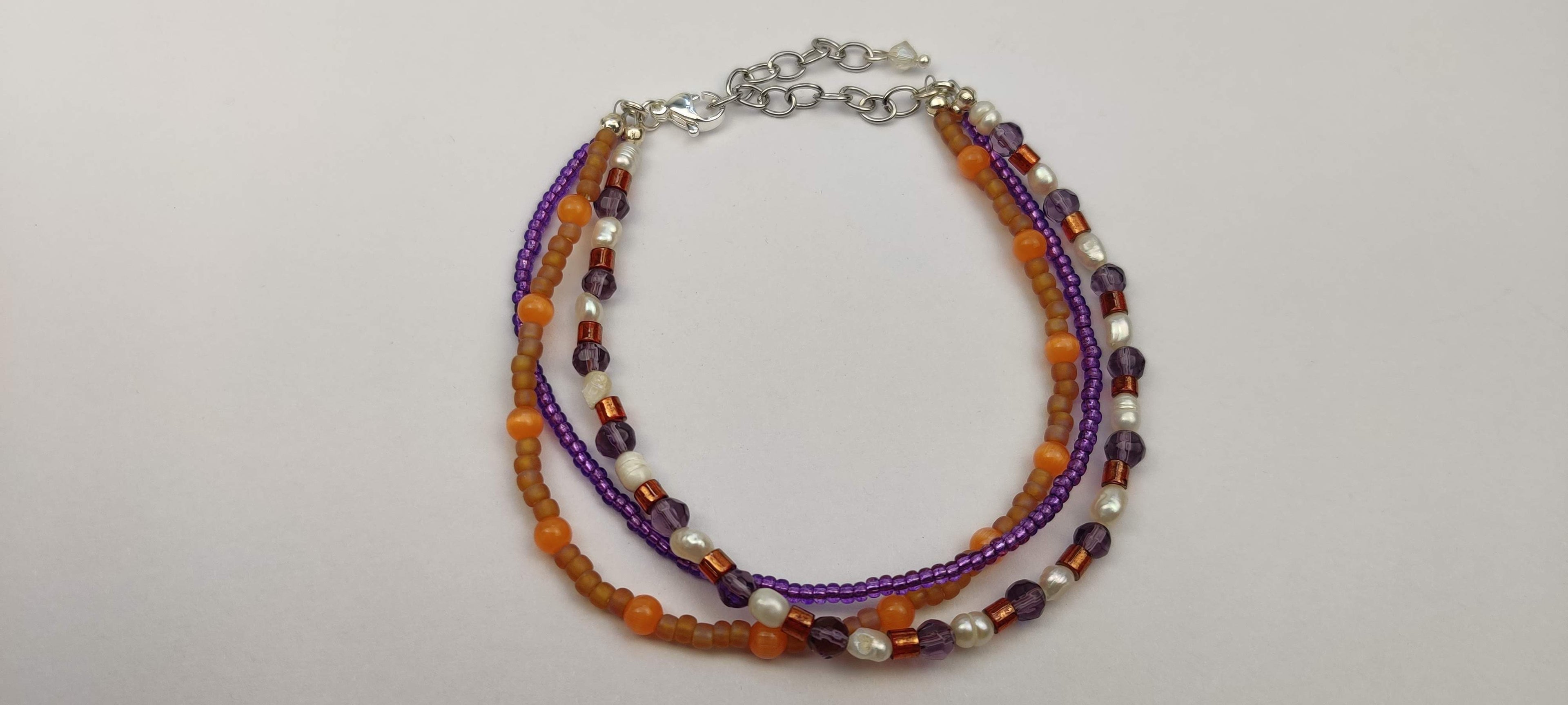 Three Strand Orange, Purple, and Freshwater Pearls Bracelet with Gold, Brown, and Black Glass Beads