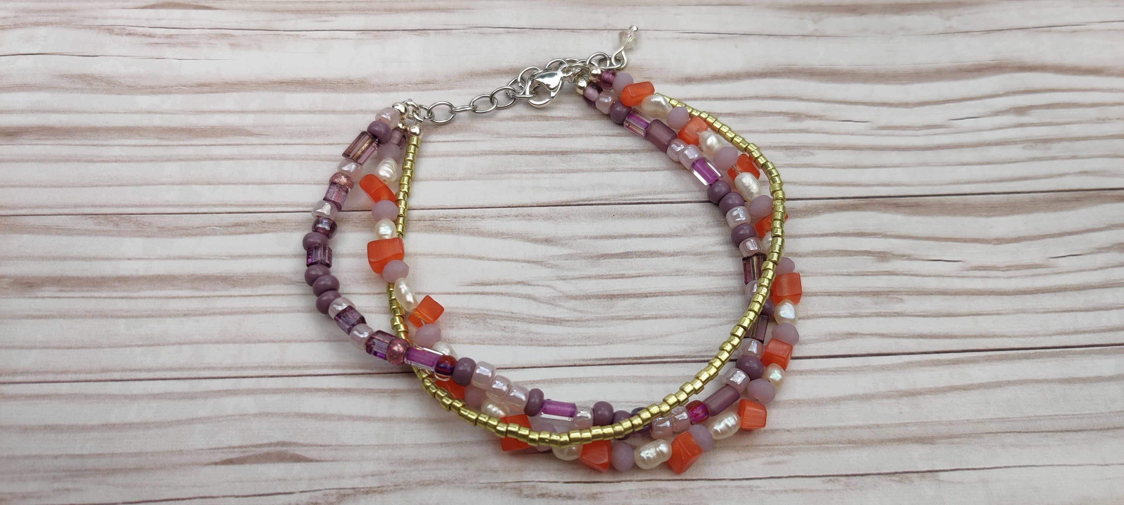 Three Strand Bracelet with Gold, Purple, Orange, and Freshwater Pearls Glass Beads
