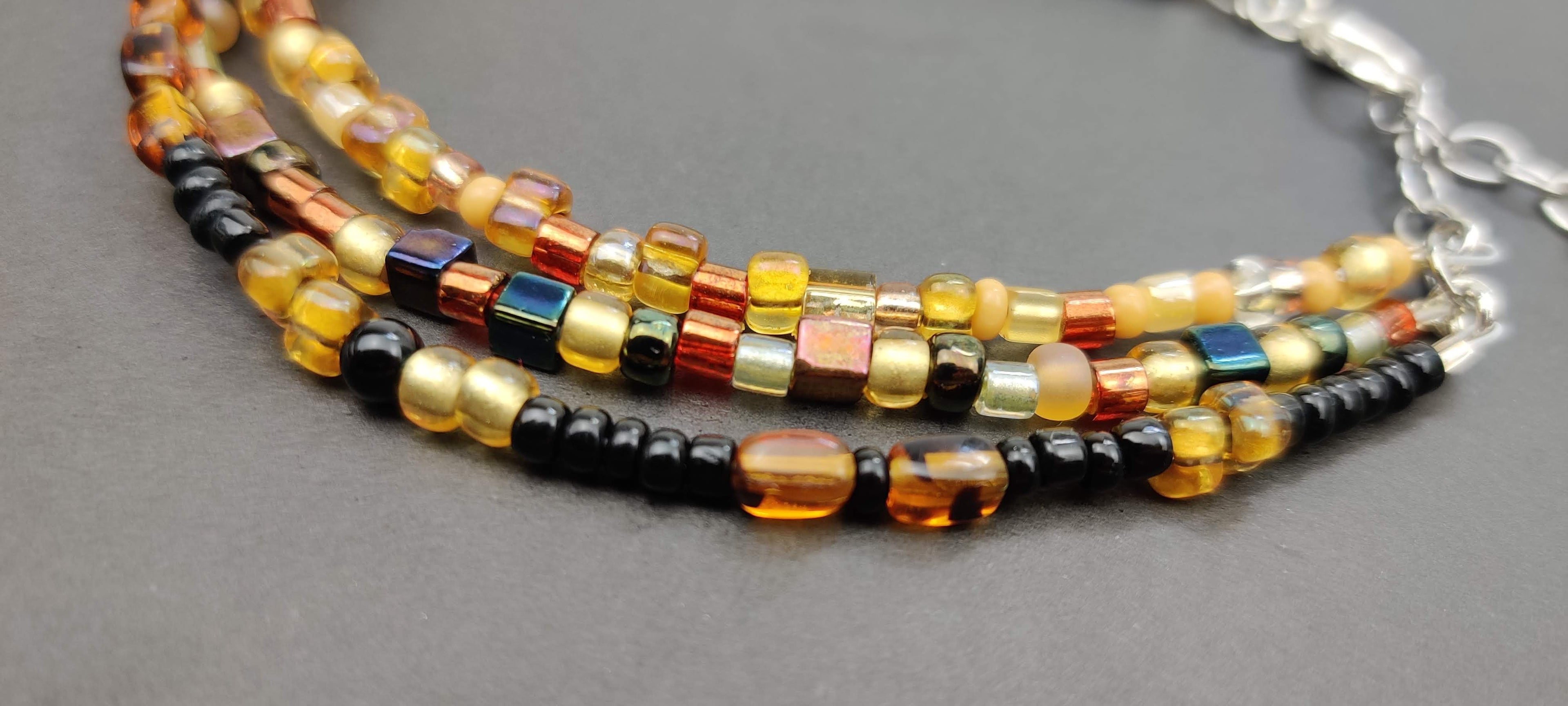 Three Strand Minimalist Bracelet with Gold, Brown, and Black Glass Beads